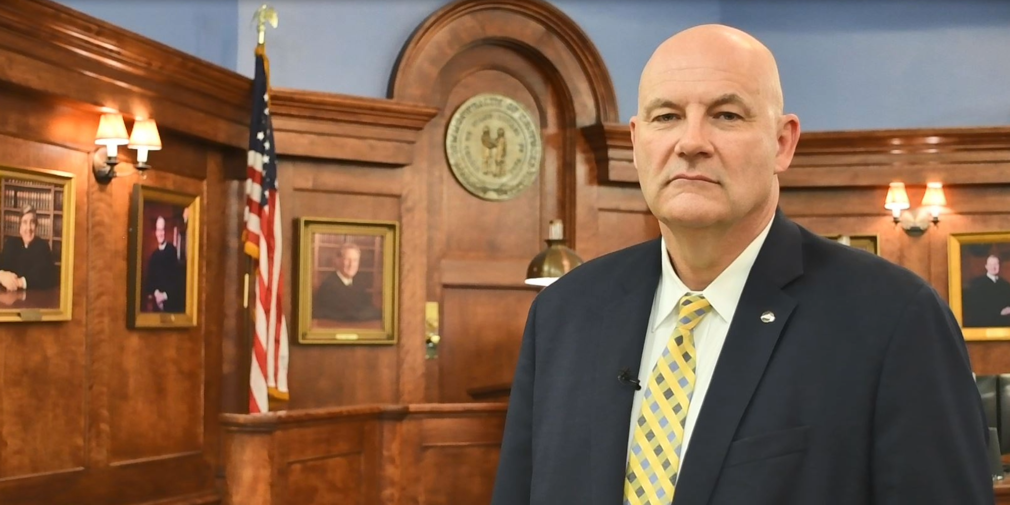 Darren Allen, Manager of Division of Court Secuirty standing to talk about arrest warrants and scam alerts.